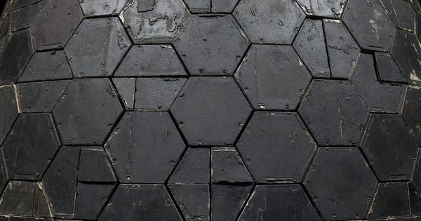 Close-up of spacecraft heat shield tiles with ablative thermal protection coating